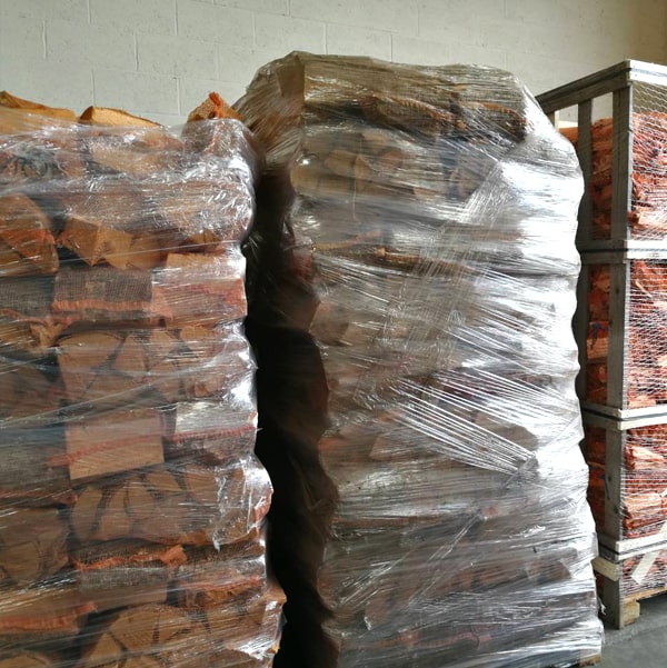 Shrink-wrapped pallets of birch firewood ready for loading
