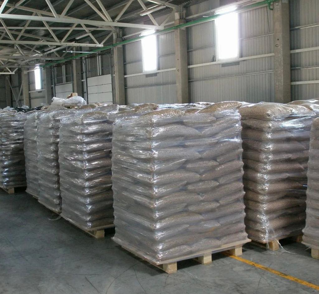 Pallets of bagged wood pellets in storage
