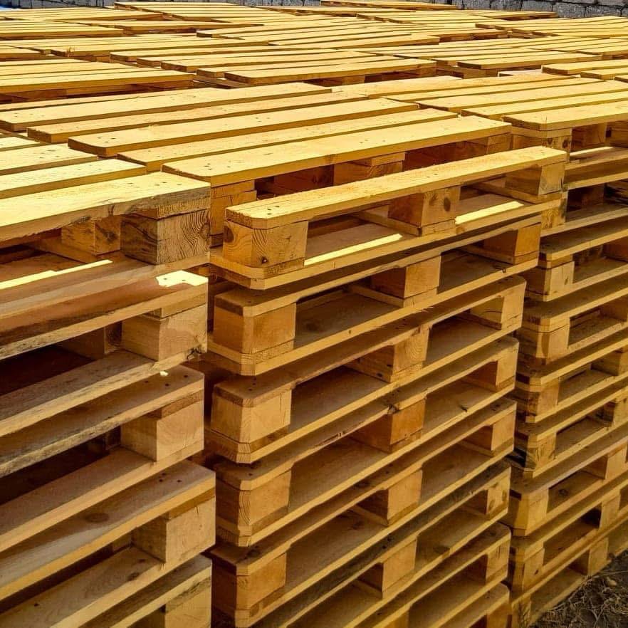 Close view of stacked EPAL euro pallets