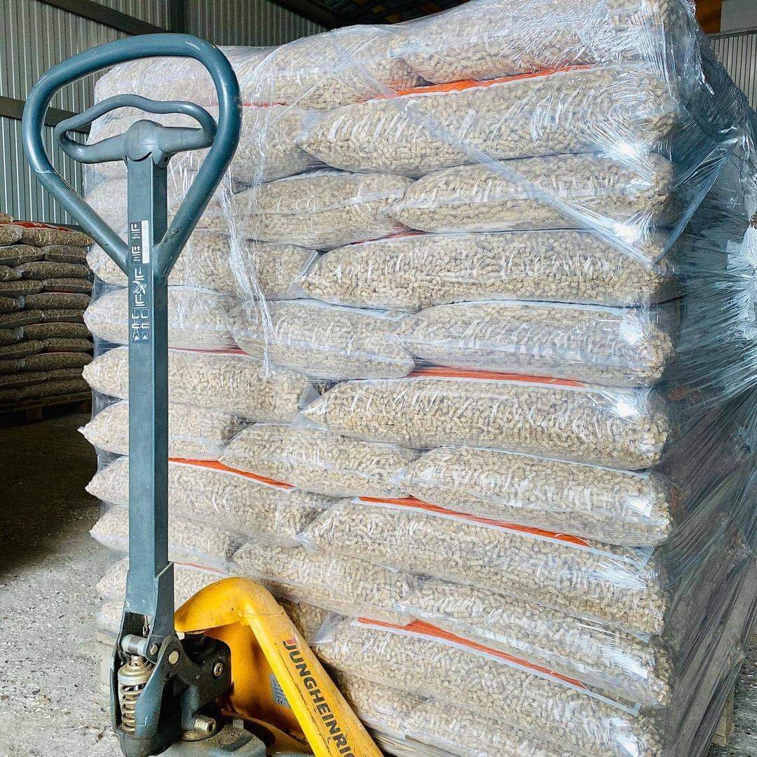 Wrapped bags of wood pellets on a warehouse pallet